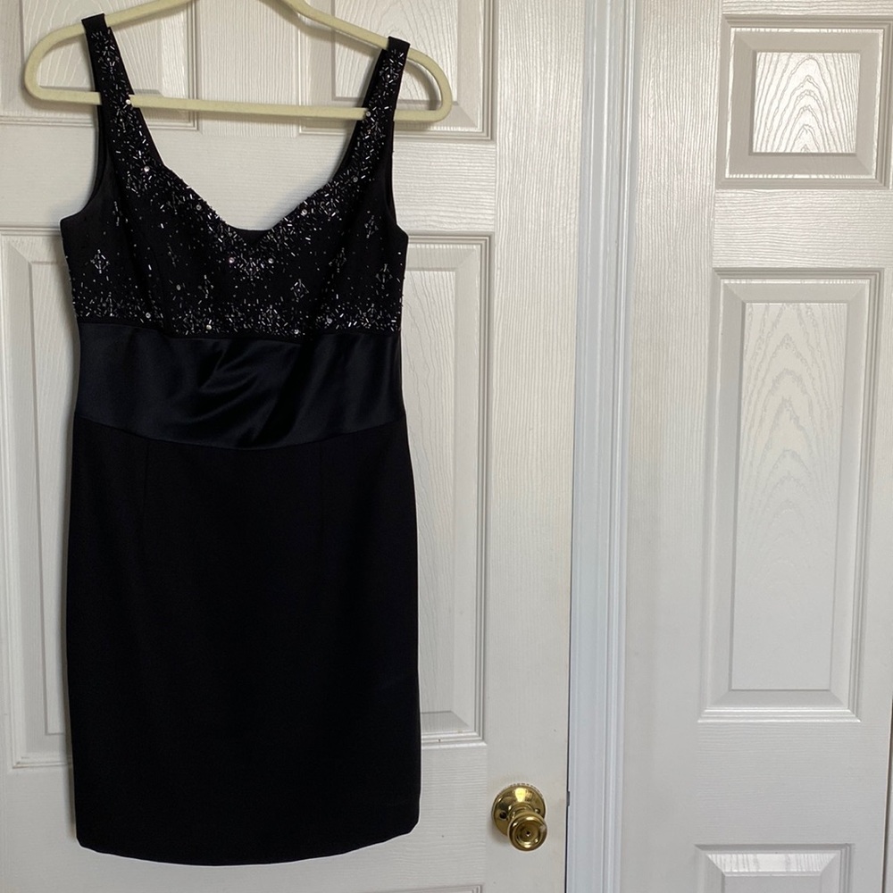 Black semi formal cocktail dress. Beaded at the top.
